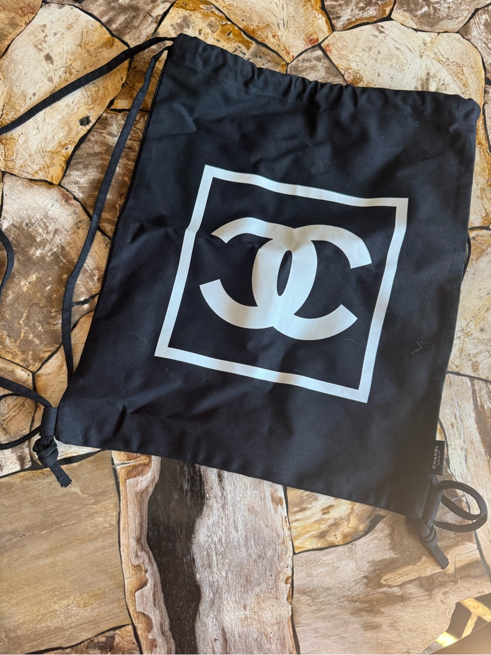 CHANEL Black Drawstring Bag with White CC Emblem